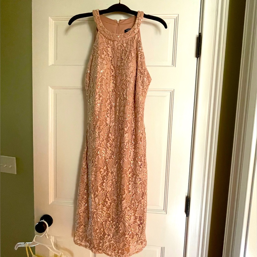 Flesh colored halter top sequins dress.